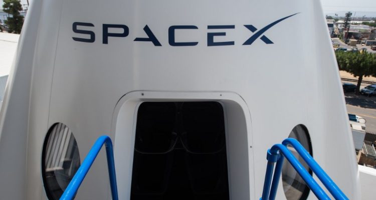 A mock up of the Crew Dragon spacecraft is displayed during a media tour of SpaceX headquarters and rocket factory on August 13, 2018 in Hawthorne, California. 
SpaceX plans to use the spaceship Crew Dragon, a passenger version of the robotic Dragon cargo ship, to carry NASA astronauts to the International Space Station in 2019. / AFP PHOTO / Robyn Beck